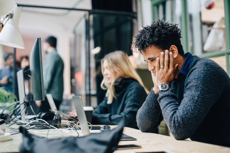 Man looking non-motivated at work. (Getty Images)