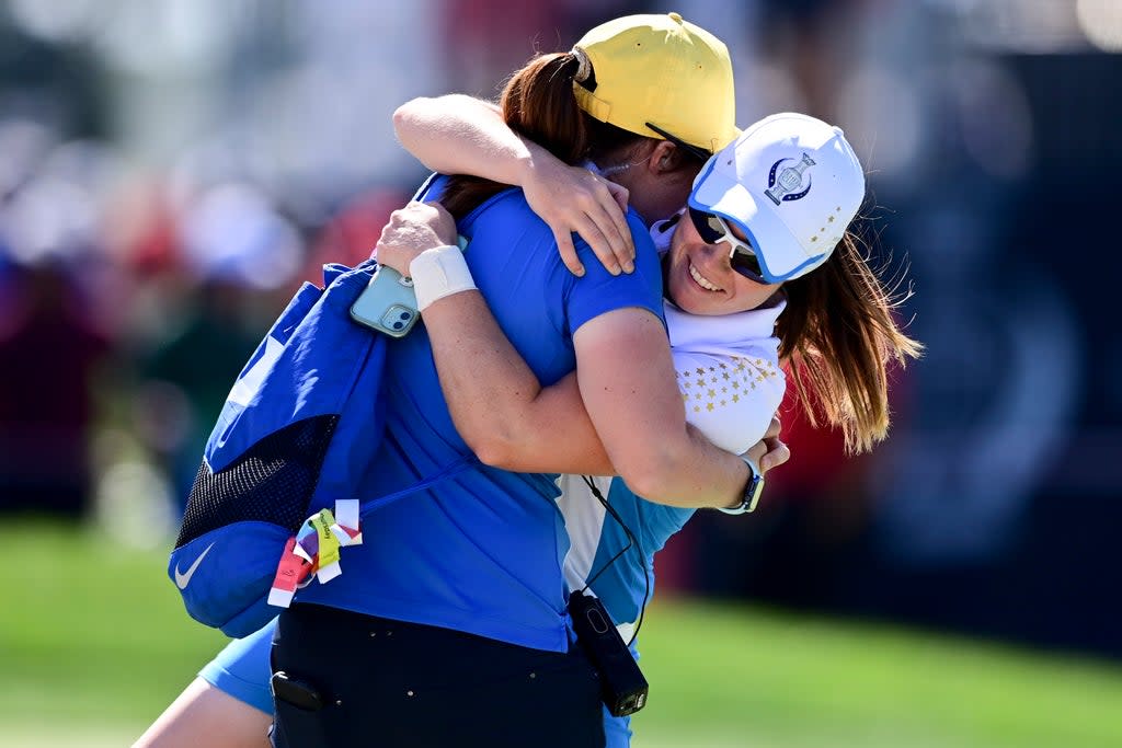 Europe’s Leona Maguire (right) celebrates with her sister Lisa after beating Jennifer Kupcho in the Solheim Cup (David Dermer/AP) (AP)