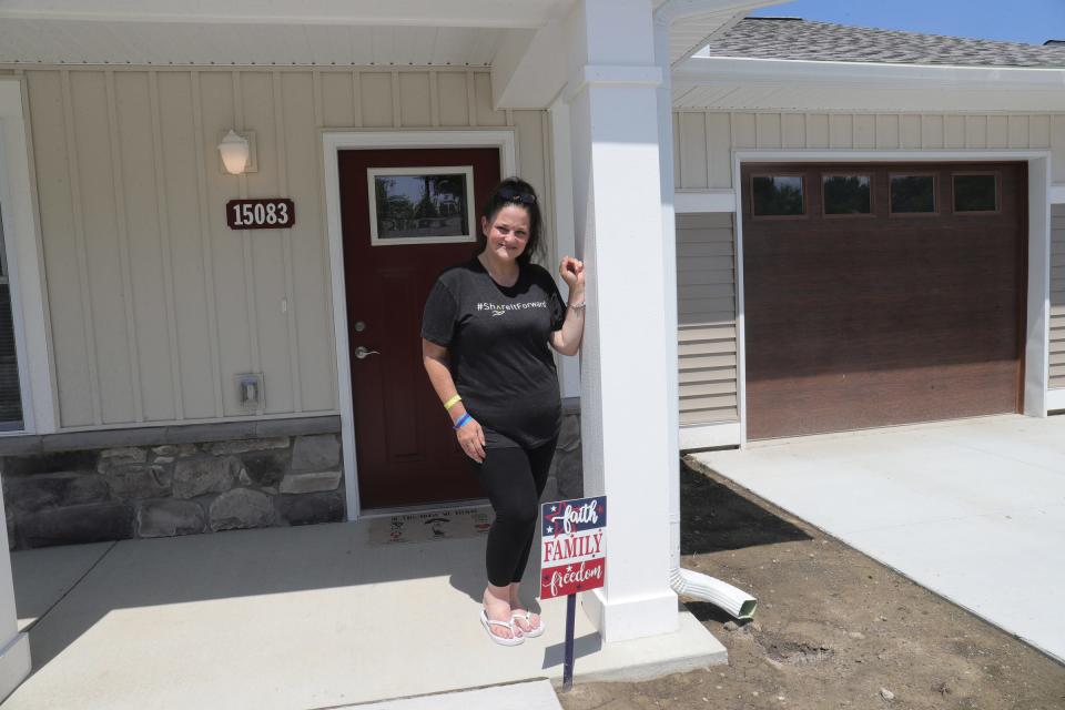 Monica Meldrum in front of her new home in Eastpointe July 26, 2021.