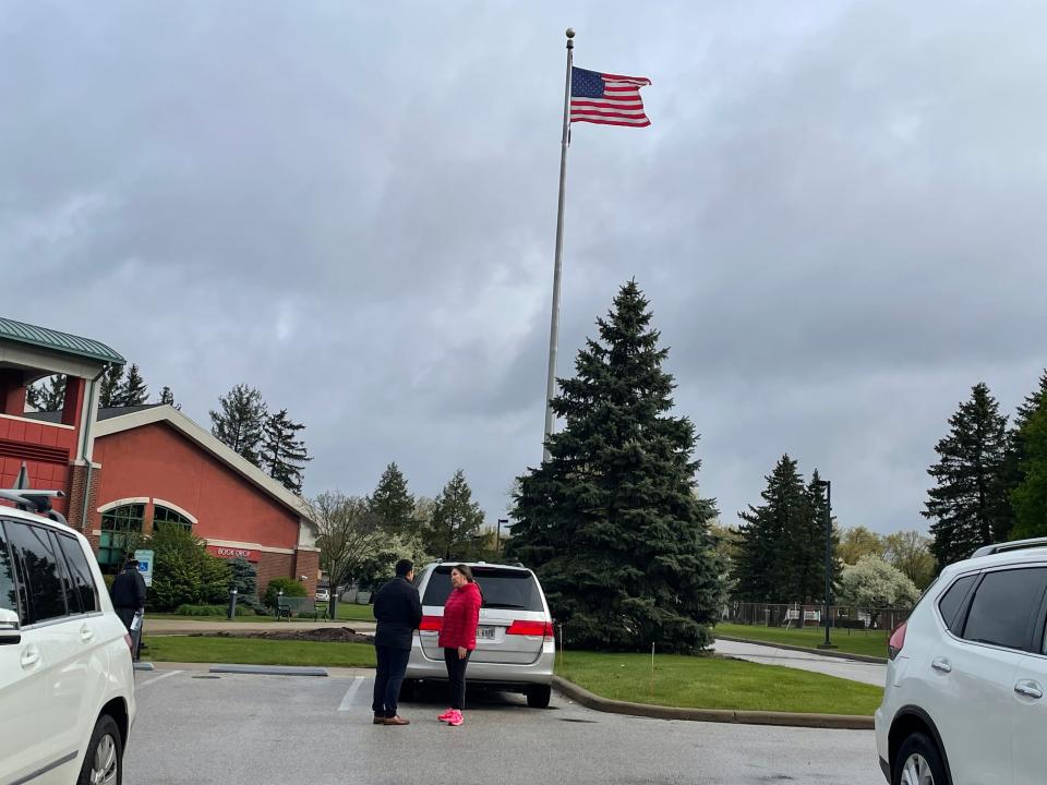 Akron voter Maya Fenty talks with Democrat mayoral candidate Shammas Malik on election day outside of the Northwest Family Recreation Center in Akron.