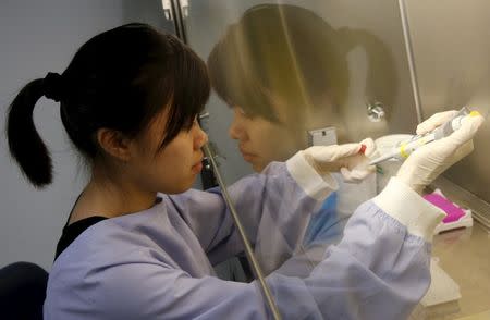 Research Associate, Karen Lee of Agency for Science Technology and Research's (A*STAR) Experimental Therapeutics Centre prepares a reaction mix to be tested with the Zika virus diagnostic test kit at their laboratory in Singapore, February 10, 2016. REUTERS/Edgar Su