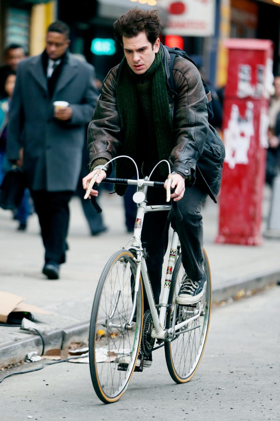 <p>Andrew Garfield rides a bike while filming a scene for Lin Manuel Miranda’s <i>Tick, Tick, Boom</i> in N.Y.C. on Tuesday. </p>