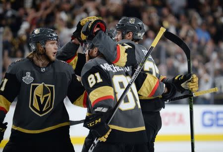 May 30, 2018; Las Vegas, NV, USA; Vegas Golden Knights defenseman Shea Theodore (27) celebrates with teammates after scoring a goal against the Washington Capitals in the second period in game two of the 2018 Stanley Cup Final at T-Mobile Arena. Gary A. Vasquez-USA TODAY Sports