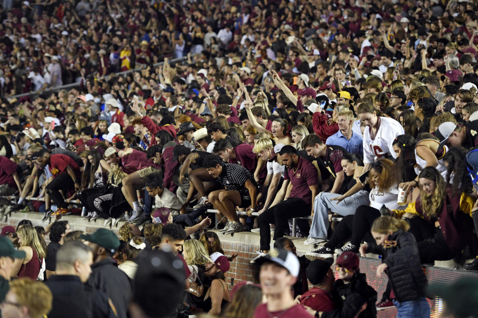 Nov. 25, 2022; Tallahassee, Florida, USA; Florida State Seminoles fans storm the field after defeating the Florida Gators at Doak S. Campbell Stadium. Melina Myers-USA TODAY Sports