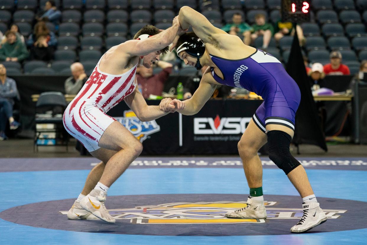 Brownsburg’s Caden Brewer and Tell City’s Landon Terry compete in the 215-pound championship match of the 2024 IHSAA Semi-State Wrestling tournament at Ford Center in Evansville, Ind., Feb. 10, 2024.