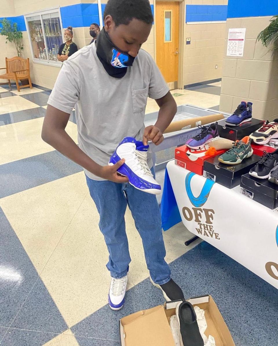 Joshua McCray and his team at Off the Wave host shoe drives to give back to students.