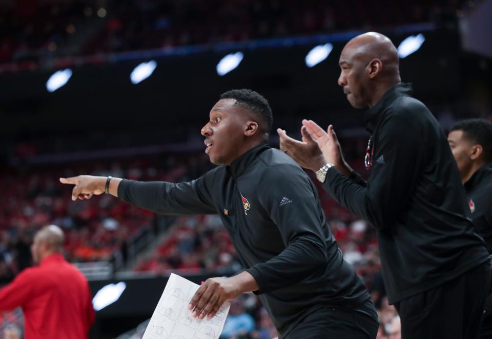 U of L assistant coach Nolan Smith instructs the team against against Virginia at the Yum Center in Louisville, Ky. on Feb. 15, 2023.  