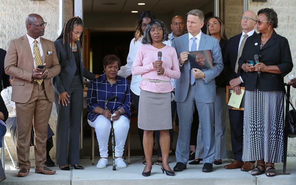 Lajuana Walker-Dawkins, center, speaks during a press conference following her nephew's death.