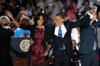 <p>President Barack Obama stands on stage with first lady Michelle Obama after his victory speech on election night at McCormick Place November 6, 2012 in Chicago, Illinois. Obama won reelection against Republican candidate, former Massachusetts Governor Mitt Romney. (Scott Olson/Getty Images) </p>