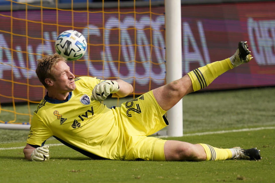 The ball gets past Sporting Kansas City goalkeeper Tim Melia for an FC Dallas goal during the first half of an MLS soccer match in Kansas City, Kan., Saturday, Sept. 19, 2020. (AP Photo/Orlin Wagner)