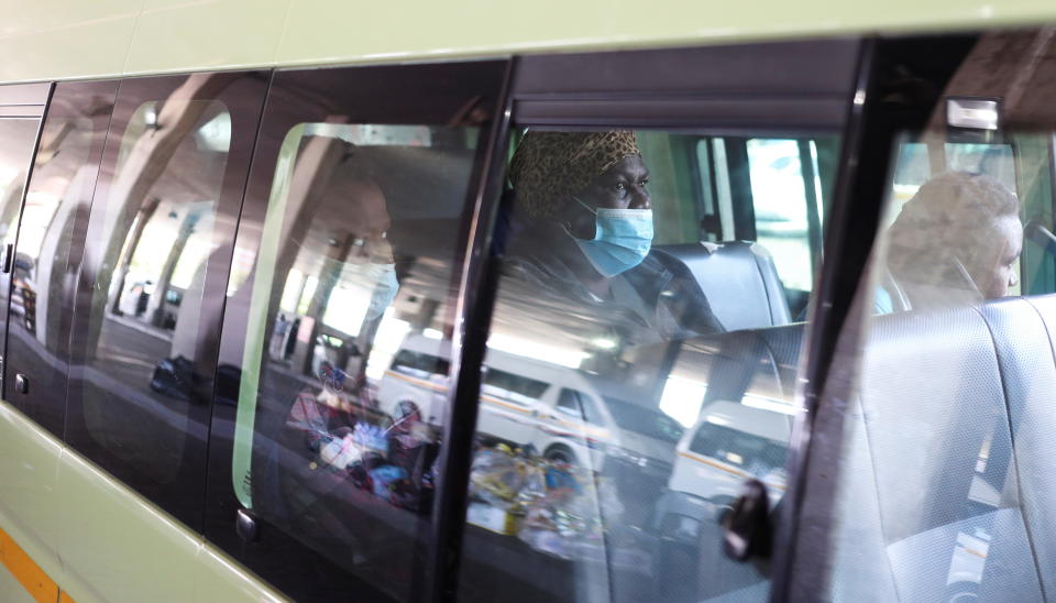 A passenger is seen wearing a face mask in a taxi in Soweto, South Africa, on November 26, 2021,   after the announcement of British and French bans on flights from the country because of the detection of a new COVID-19 variant there. / Credit: SIPHIWE SIBEKO/REUTERS