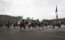 Mounted troops participate in the annual Independence Day military parade in Mexico City’s main square of the capital, the Zócalo, Wednesday, Sept. 16, 2020. Mexico celebrates the anniversary of its independence uprising of 1810. ( AP Photo/Marco Ugarte)