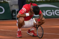 Serbia's Novak Djokovic reacts after defeating Stefanos Tsitsipas of Greece in their final match of the French Open tennis tournament at the Roland Garros stadium Sunday, June 13, 2021 in Paris. (AP Photo/Michel Euler)