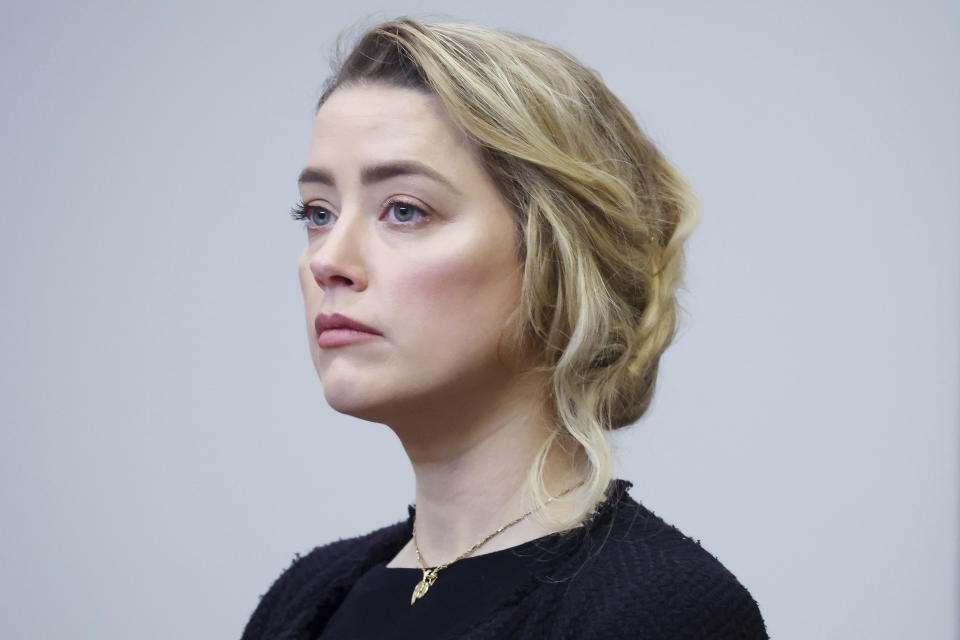 Actor Amber Heard arrives in the courtroom at the Fairfax County Circuit Court in Fairfax, Va., Thursday, April 28, 2022. Actor Johnny Depp sued his ex-wife actor Amber Heard for libel in Fairfax County Circuit Court after she wrote an op-ed piece in The Washington Post in 2018 referring to herself as a "public figure representing domestic abuse." (Michael Reynolds/Pool Photo via AP)