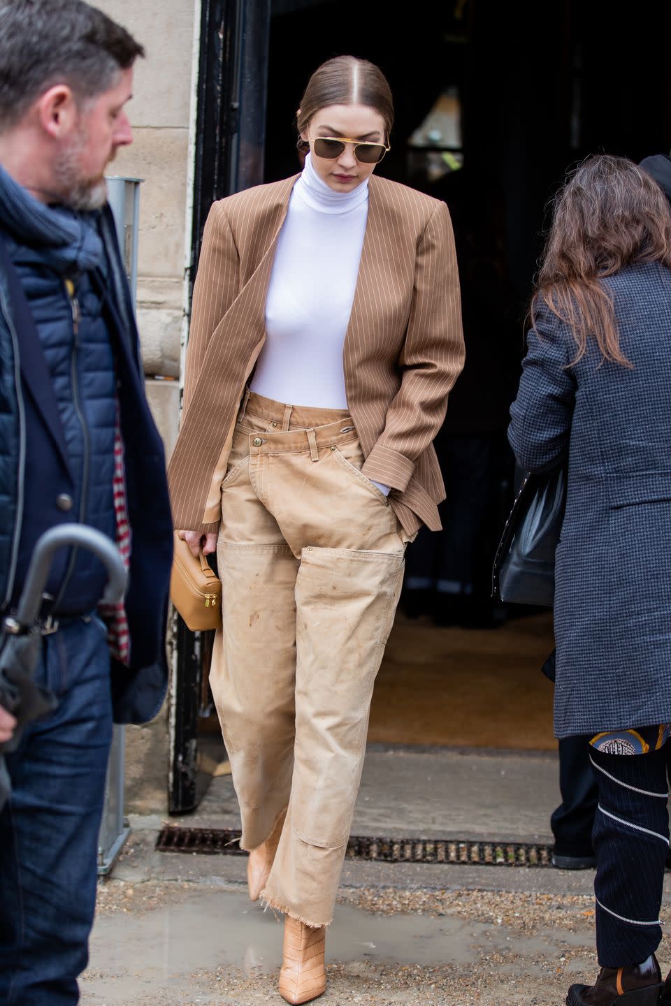 <p>Layering sandy earth tones is one of Instagram's biggest style aesthetics atm. But all that khaki needs a little help to not come off boring – thankfully, ya girl Gigi knows that texture is key. </p>