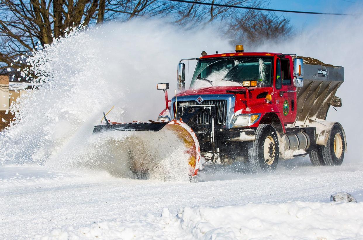 A Delaware County plow works to clear a section of South Cowan Road after eight inches of snow fell in the county during a past winter.