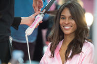 <p>Cindy Bruna smiled big for the camera as she got her hair curled. <em>(Photo: Getty Images)</em> </p>