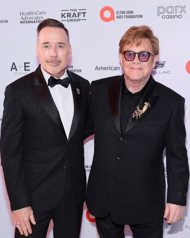 <p>Theo Wargo/Getty</p> David Furnish and Elton John at the Elton John AIDS Foundation's 23rd annual Academy Awards Viewing Party on March 10, 2024