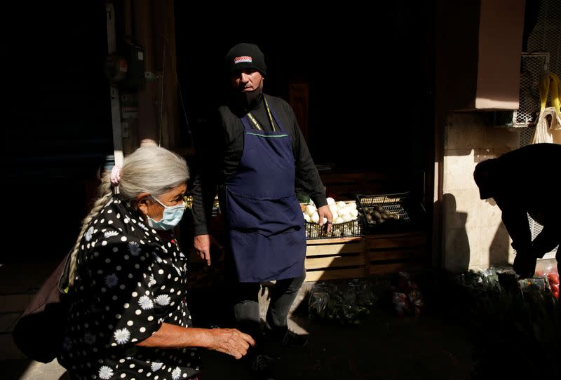 A migrant under the "Remain in Mexico" program, works in Ciudad Juarez