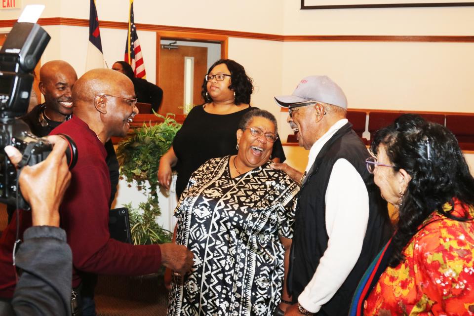 "Ms. Sheila" (Arnold), the storyteller who tells the story of the Scarboro 85, shares a laugh with local residents at Oak Valley Baptist Church in the Scarboro community. At right is one of the Scarboro 85, L.C. "Larry" Gipson.