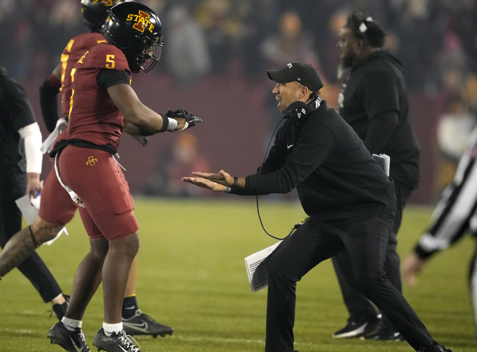 Iowa State head coach Matt Campbell, right, celebrates after a forced fourth down with defensive back Myles Purchase (5) during the first half of an NCAA college football game against Texas, Saturday, Nov. 18, 2023, in Ames, Iowa. (AP Photo/Matthew Putney)