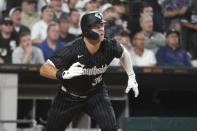 Chicago White Sox's Gavin Sheets watches his two-run double off Houston Astros starting pitcher Justin Verlander during the seventh inning of a baseball game Tuesday, Aug. 16, 2022, in Chicago. (AP Photo/Charles Rex Arbogast)