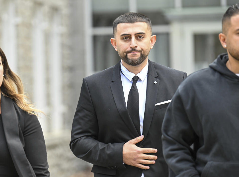 Nauman Hussain, who ran the limousine company involved in the 2018 crash that killed 20 people, walks outside during a lunch break in a new trial in Schoharie, N.Y., on Monday, May 1, 2023. Judge Peter Lynch, rejected a plea agreement for Hussain to avoid prison time. (AP Photo/Hans Pennink)
