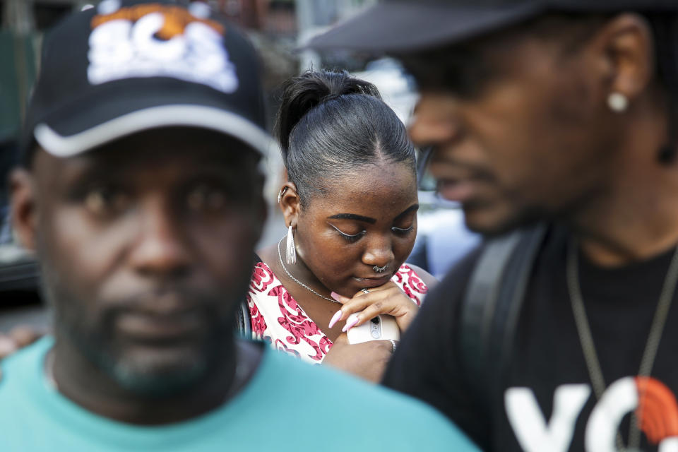 Alecia Armstrong bows her head in prayer during a Save Our Streets shooting response rally in the Bedford-Stuyvesant neighborhood of Brooklyn, N.Y., on July 24, 2018. (Seth Wenig / AP file)