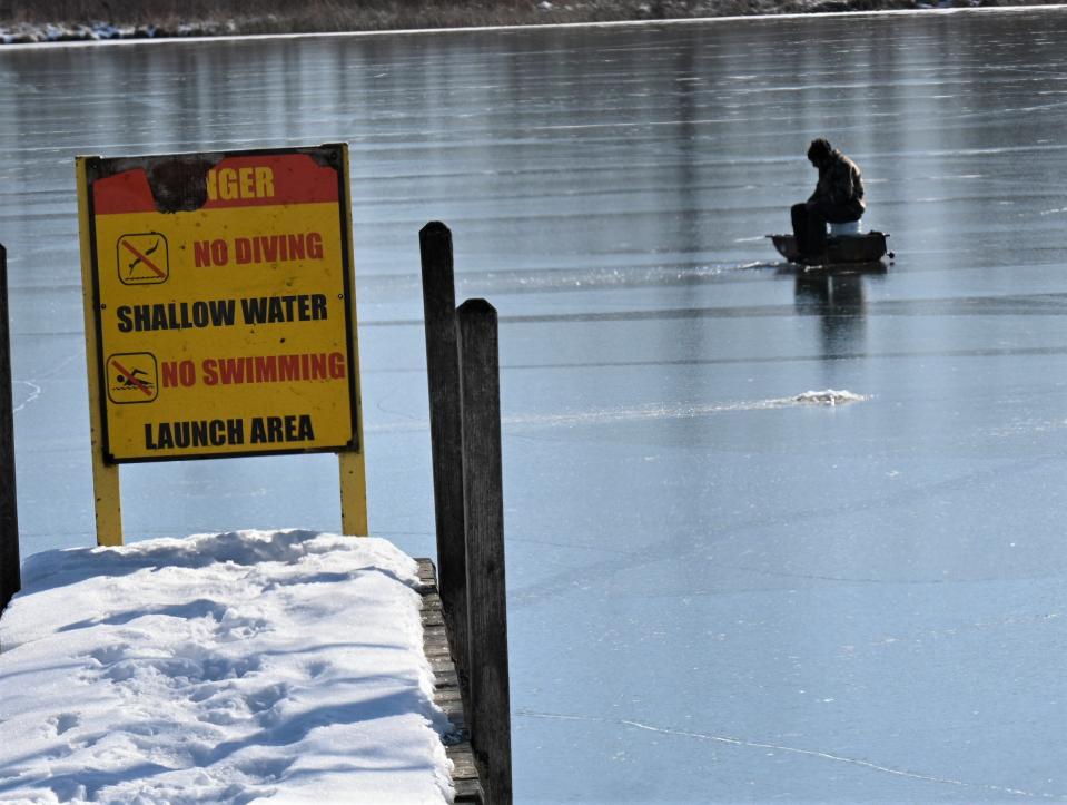 A lone fisherman sat out on Cary Lake Saturday fishing.