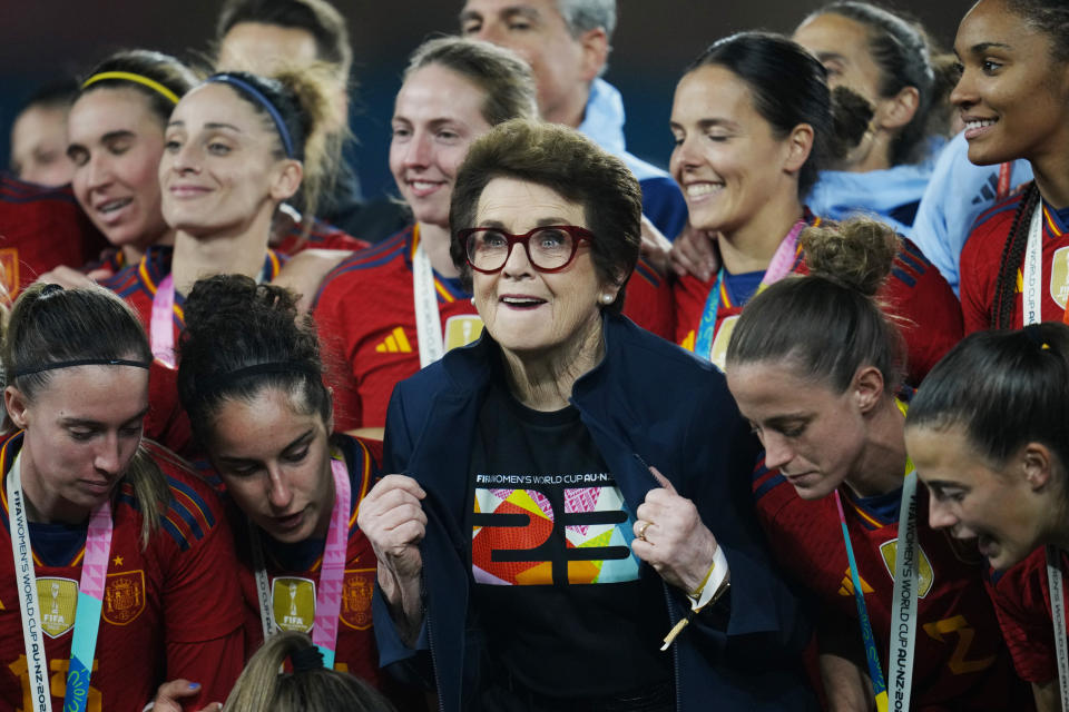 Tennis legend Billie Jean King poses with Spain players at the end of the Women's World Cup soccer final between Spain and England at Stadium Australia in Sydney, Australia, Sunday, Aug. 20, 2023. Spain won 1-0. (AP Photo/Abbie Parr)