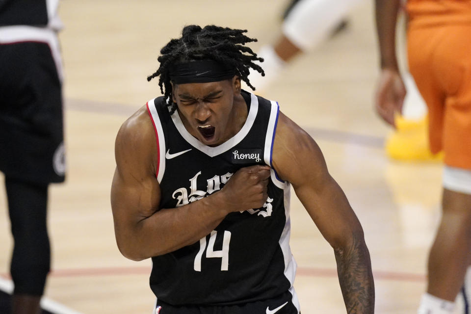 Los Angeles Clippers guard Terance Mann celebrates after scoring during the second half in Game 3 of the NBA basketball Western Conference Finals against the Phoenix Suns Thursday, June 24, 2021, in Los Angeles. (AP Photo/Mark J. Terrill)