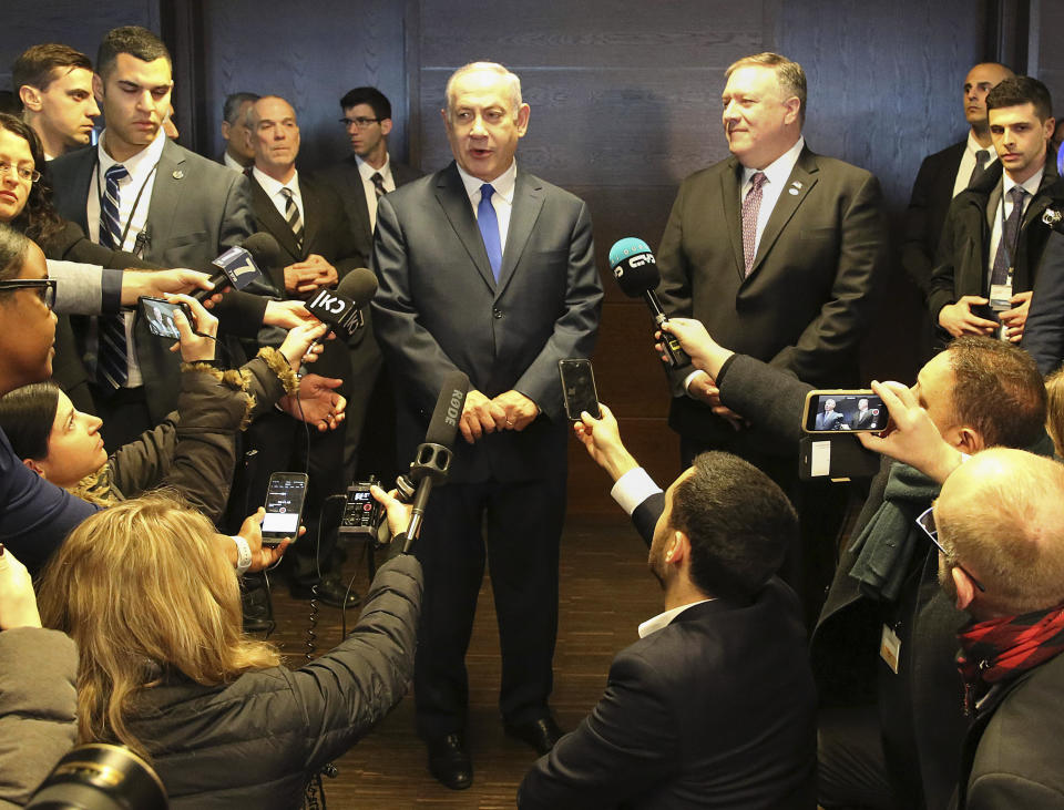 FILE - In this Thursday, Feb. 14, 2019 file photo, Israeli Prime Minister Benjamin Netanyahu, center left, and US Secretary of State Mike Pompeo, center right, address journalists on the sidelines of an international conference on the Middle East in Warsaw, Poland. An off-hand comment by Netanyahu in Warsaw about Poland and the Holocaust looks to overshadow a summit of central European leaders this week in Israel. Poland’s abrupt decision Sunday to downgrade its participation in the Visegrad conference suddenly cast a pall gathering. (AP Photo/Czarek Sokolowski, File)