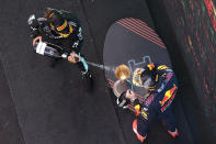 Winner Mercedes driver Lewis Hamilton of Britain sprays second placed Red Bull driver Max Verstappen of the Netherlands, right, on the podium of the Spanish Formula One Grand Prix at the Barcelona Catalunya racetrack in Montmelo, just outside Barcelona, Spain, Sunday, May 9, 2021. (Lars Baron/Pool via AP)