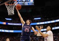 <p>Joe Rahon (25) of St. Mary’s lays the ball up around Chance Comanche (21) of Arizona during the 2017 NCAA Men’s Basketball Tournament held at Vivint Smart Home Arena on March 18, 2017 in Salt Lake City, Utah. (Photo by Jack Dempsey/NCAA Photos via Getty Images) </p>