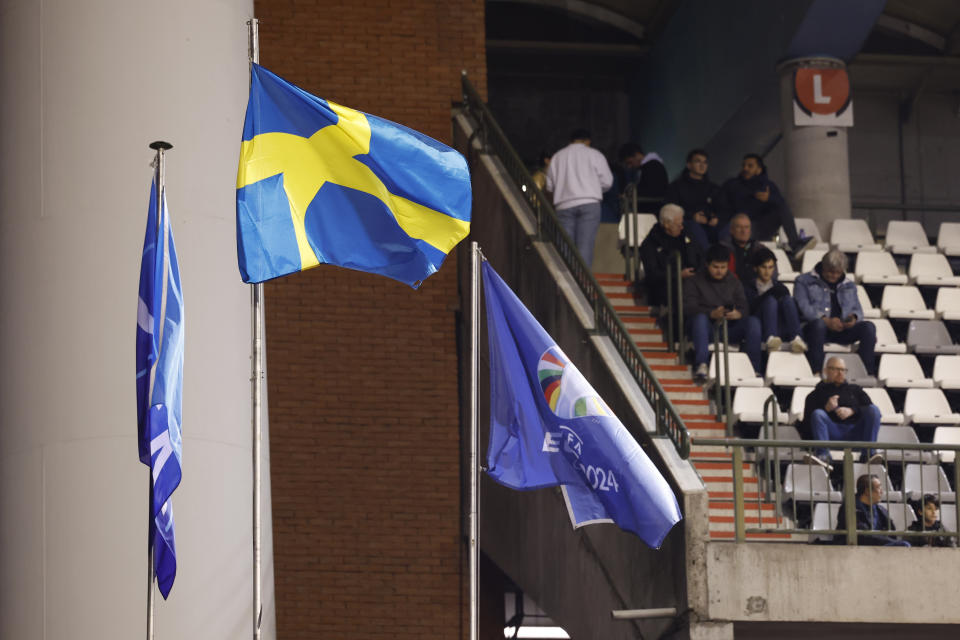 The Swedish flag is on a mast after abandonment of the Euro 2024 group F qualifying soccer match between Belgium and Sweden at the King Baudouin Stadium in Brussels, Monday, Oct. 16, 2023. The match was abandoned at halftime after two Swedes were killed in a shooting in central Brussels before kickoff. (AP Photo/Geert Vanden Wijngaert)