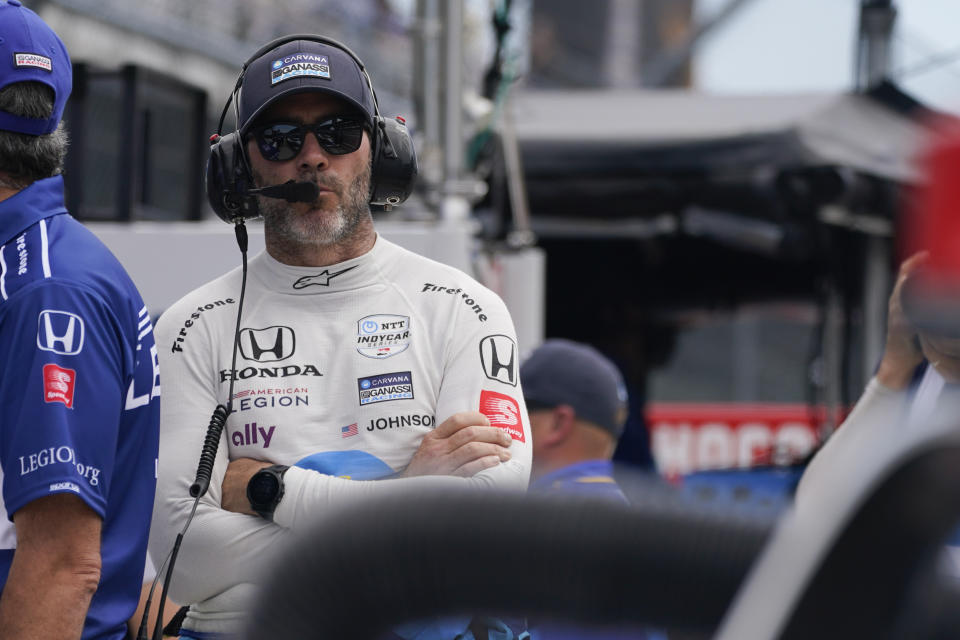 Jimmie Johnson stands on pit lane during practice for the Indianapolis 500 auto race at Indianapolis Motor Speedway, Tuesday, May 17, 2022, in Indianapolis. (AP Photo/Darron Cummings)