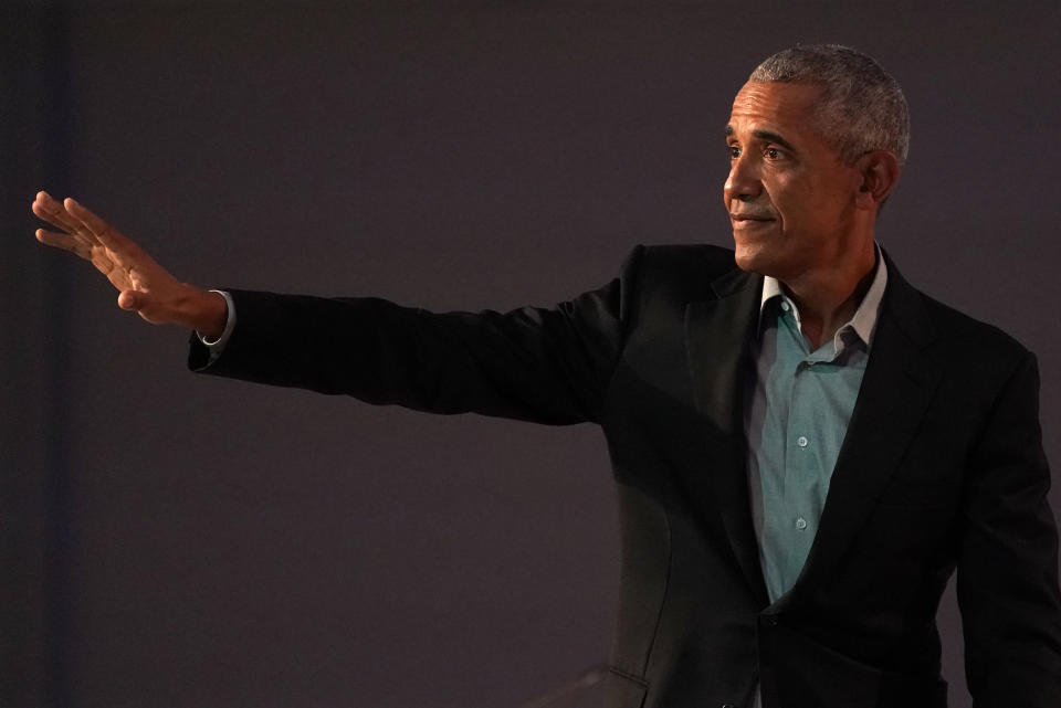 Former U.S. President Barack Obama waves after making a speech during the COP26 U.N. Climate Summit in Glasgow, Scotland, Monday, Nov. 8, 2021. The U.N. climate summit in Glasgow is entering it's second week as leaders from around the world, are gathering in Scotland's biggest city, to lay out their vision for addressing the common challenge of global warming. (AP Photo/Alberto Pezzali)