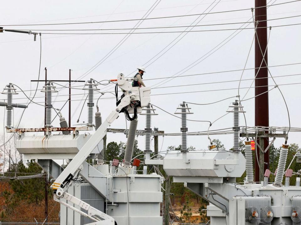 PHOTO: In Dec. 4, 2022, Duke Energy personnel work to restore power at a second crippled electrical substation after the Moore County Sheriff said that vandalism caused a mass power outage, in Carthage, N.C. (Jonathan Drake/Reuters, FILE)