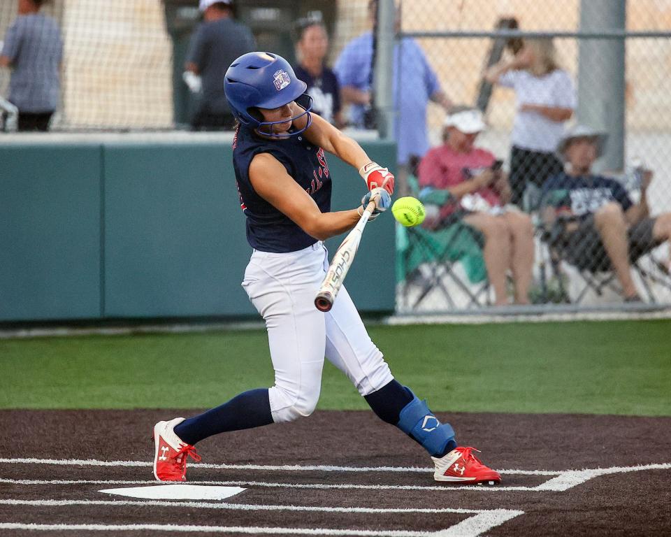 Hays' Katie Noble smashes a liner for the South squad in the 2022 Austin Area All-Star Softball Game on Wednesday at Dripping Springs High School. In the annual meeting between the top seniors from the past season, the South squad beat the North 11-3.