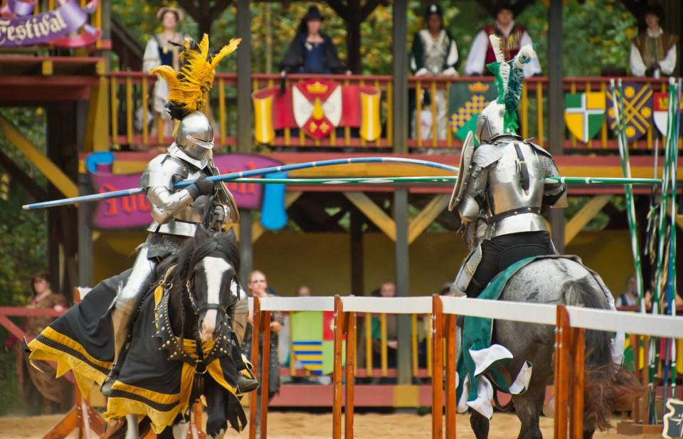 Knights battle in a joust three times daily in the Carolina Renaissance Festival’s tournament arena.