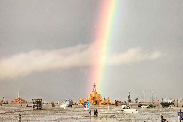<p>JOSH LEASE/UGC/AFP via Getty</p> A rainbow over Burning Man 2023