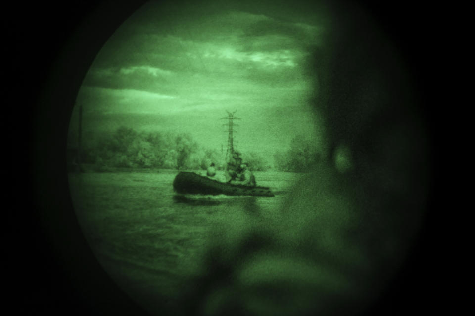 Ukraine Special Operations Forces soldiers navigate the Dnipro River using night vision goggles, or NVG, during a night mission in Kherson region, Ukraine, Sunday, June 11, 2023. (AP Photo/Felipe Dana)