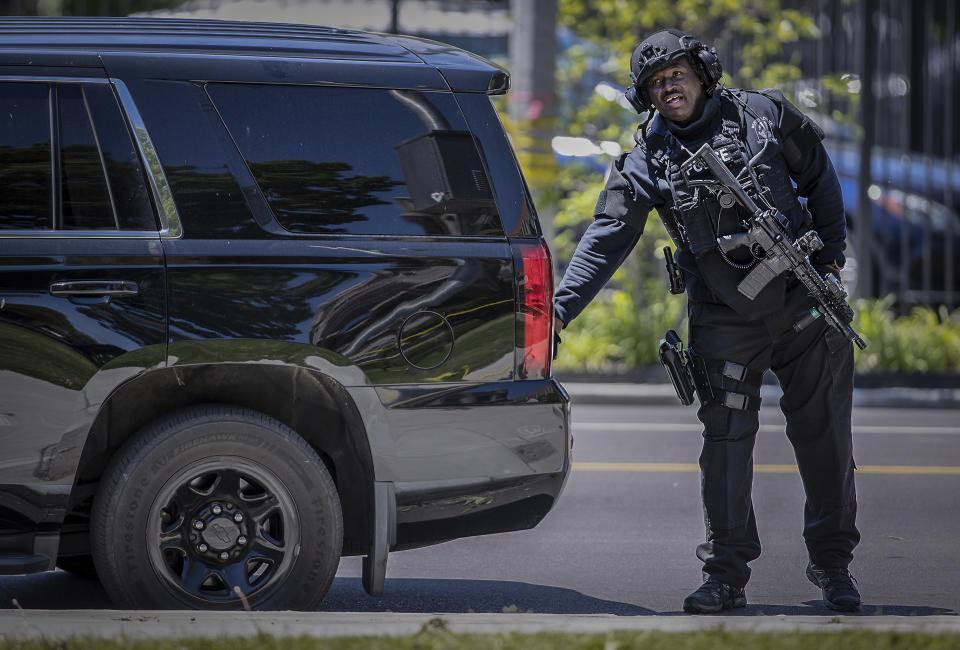 Memphis Police officers load up their tactical gear after diffusing an active shooter situation near the University of Memphis Tuesday, May 2, 2023. (Patrick Lantrip/Daily Memphian via AP)