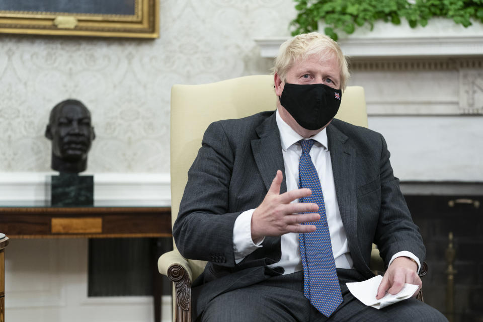 British Prime Minister Boris Johnson speaks during a meeting with President Joe Biden in the Oval Office of the White House, Tuesday, Sept. 21, 2021, in Washington. (AP Photo/Alex Brandon)