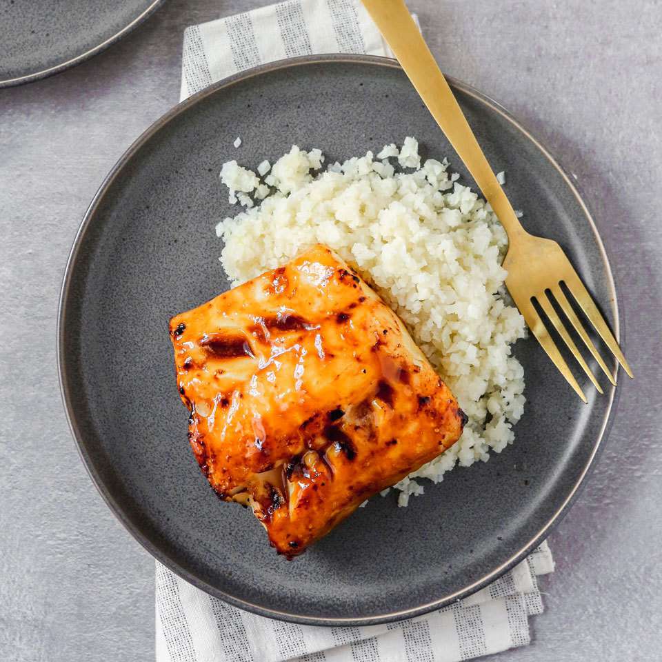 <p>This healthy fish recipe comes together fast with just three ingredients you can always have on hand in your freezer and fridge. Store-bought teriyaki glaze makes a great marinade for cod that doubles as a sauce for the cauliflower rice. <a href="https://www.eatingwell.com/recipe/264168/teriyaki-glazed-cod-with-cauliflower-rice/" rel="nofollow noopener" target="_blank" data-ylk="slk:View Recipe;elm:context_link;itc:0;sec:content-canvas" class="link ">View Recipe</a></p>