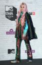 <p>Kesha wore a multicolour cape and matching sequined pants.</p>