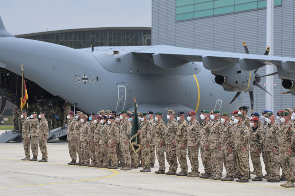 German soldiers line up for the final roll call near an Airbus A400M cargo plane of the German armed forces Bundeswehr, after returning from Afghanistan at the airfield in Wunstorf, Germany, June 30, 2021.   Hauke-Christian Dittrich/Pool via REUTERS