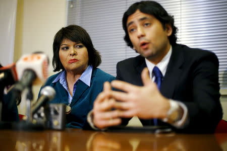 Carmen Gloria Quintana (L), who suffered serious injuries when she was set on fire during a Santiago labor strike in 1986 with U.S. citizen Rodrigo Rojas, a 19-year-old U.S. student who died, and Francisco Ugas, executive secretary of the Human Rights Program, deliver a news conference at Santiago, Chile, July 29, 2015. REUTERS/Ivan Alvarado