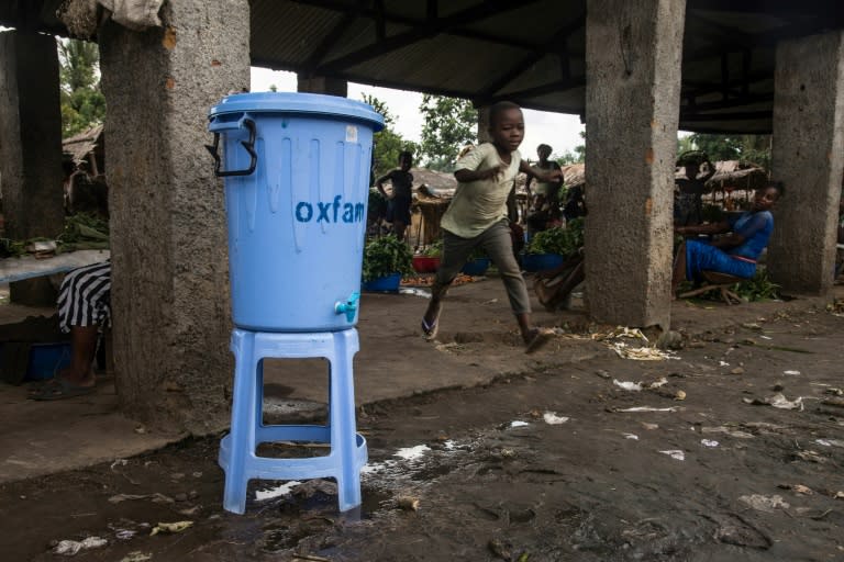 Dispensers containing water mixed with disinfectant are being used in Mbandaka during the Ebola outbreak