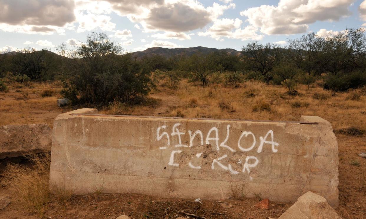 <span>A reference to the Sinaloa cartel along a well-known smuggling route in Sahuarita, Arizona.</span><span>Photograph: Norma Jean Gargasz/Alamy</span>